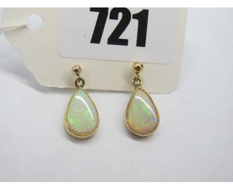 A Pair of Modern 9ct Gold Opal Set Earrings, pear shape collet set. 