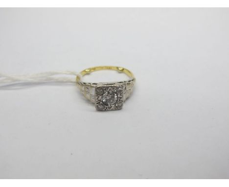An Art Deco Diamond Set Ring, the high square panel set with graduated old and single cut stones, between textured stepped sh