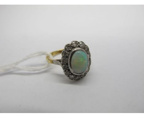 An Opal Set Cluster Ring, oval collet cabochon set to the centre, within border of single cut stones.