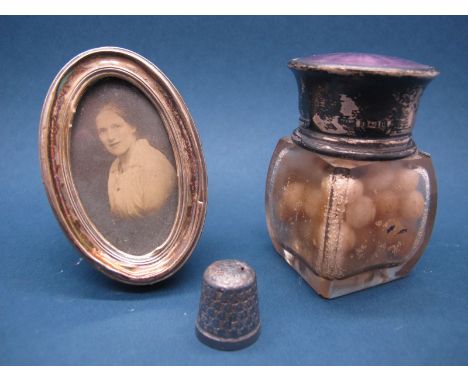 A Hallmarked Silver and Purple Enamel Topped Smelling Salts Jar, together with a small oval photograph frame, on easel back a