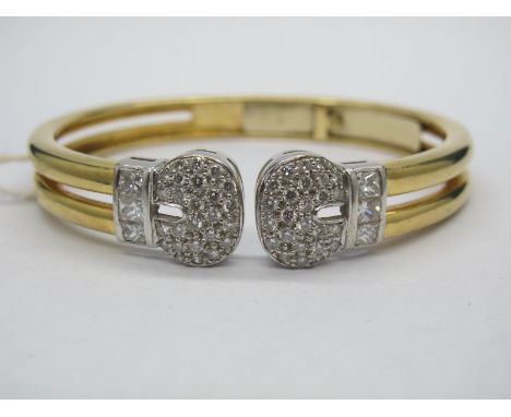 A Modern Diamond Set Bangle, of openwork plain two row design, claw set to the front with uniform brilliant cut stones and ch