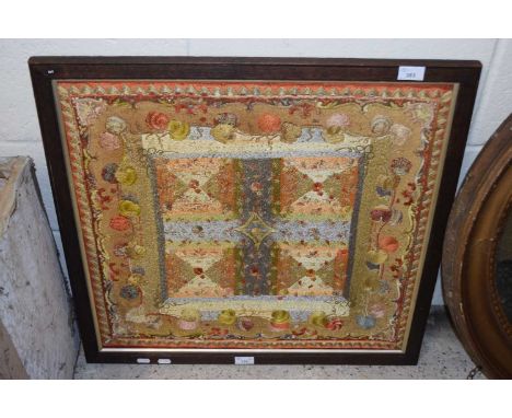 Indian needlework panel decorated with squares and scrolled detail, oak framed, 68cm wide