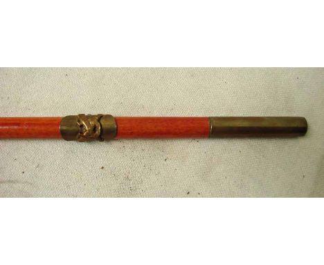 A Trench Art Swagger Stick brass mounted at both ends with applied brass badge possibly of a Horse Artillery Farrier, with cr