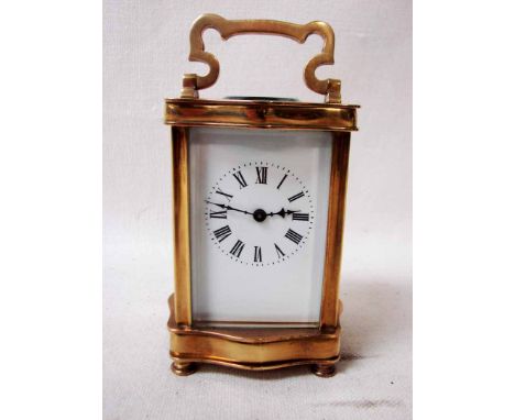A 20th century brass eight day Carriage Clock, white enamel dial with Roman numerals, five bevelled glass panels in brass ser