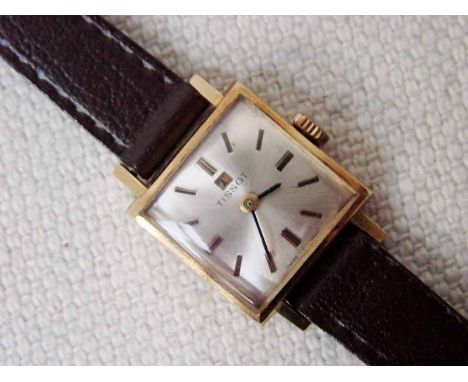 A ladies Tissot 18ct gold cased Wrist Watch on later leather strap, silvered square dial signed Tissot inscribed Swiss T Made
