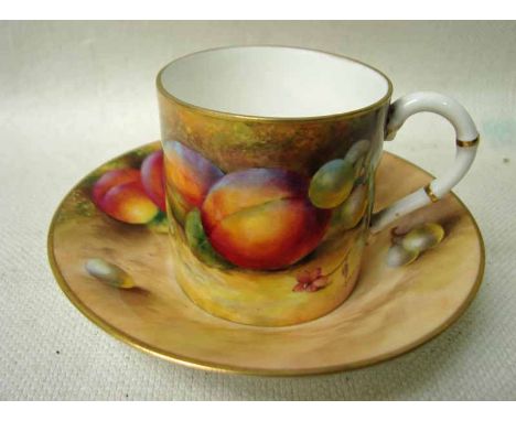 A Royal Worcester Coffee Can and Saucer, of typical straight sided form, both hand painted with peaches and grapes, gilt rims