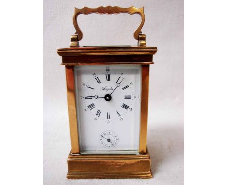 A 20th century French brass Carriage Clock, eight day movement striking a bell within the plinth, white enamel dial with Roma