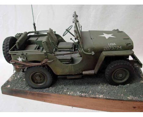 A scratch built 1/8th scale model of a US Army Willys Jeep, very good reconstruction in brass and painted, with white insigni