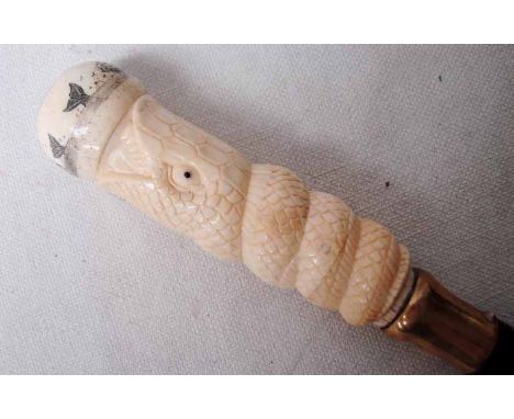 An antique Sword Stick, Scrimshaw style pommel with screw cap internally with a compass, possibly Marine ivory grip carved as