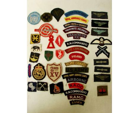 A collection of military Cloth Badges as follows: shoulder titles to include Poland, Airborne, Parachute XX1; WW2 and later B