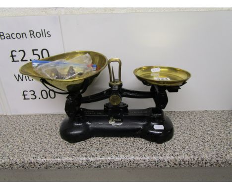 Brass scales with weights