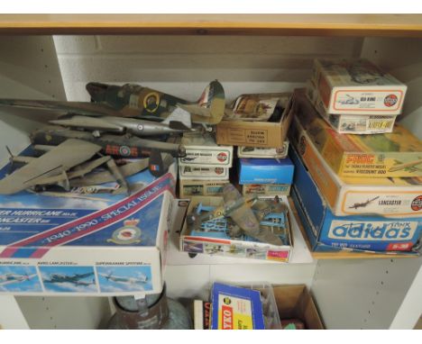 A shelf of mixed scale plastic kits, mostly Airfix aircrafts, soon part made, most boxed