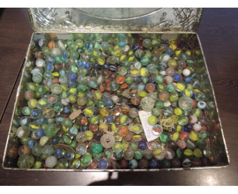 A tin of mixed vintage marbles