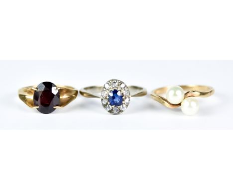 A Sapphire and Diamond Ring, 20th Century, 18ct white gold, set with a centre sapphire,  approximately .3ct, surrounded by te