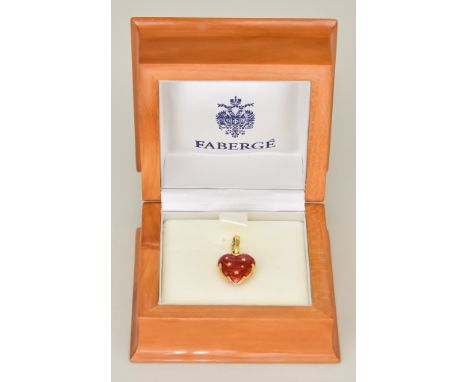 An Enamelled Strawberry Pendant, Modern, by Faberge, 28mm x 15mm, decorated with red enamel work and stars, gross weight 4.3g