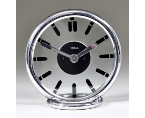 A Modern Jaeger LeCoultre Chrome and Glass Cased Mantel Timepiece, the 4.5ins circular glass dial with numeral batons, on cir