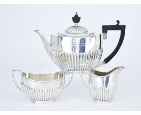 A George V Silver Oval Three Piece Tea Service, by The Goldsmiths and Silversmiths Co. Ltd, London 1914, with part reeded bod