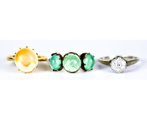 Three Gem Set Rings, 20th Century, comprising - yellow metal ring set with three cabochon emeralds, size R+, yellow metal set