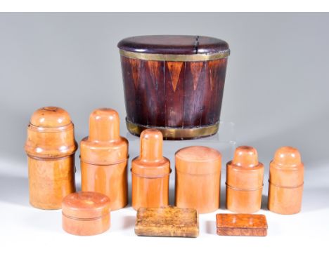 A Brass-Bound and Inlaid Mahogany Tobacco Box of Oval Outline, 19th Century, 5.5ins high, seven turned boxwood medicine boxes