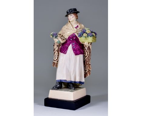 A Charles Vyse Pottery Figure -"The Shawl", circa 1926, modelled as a standing lady, a bunch of flowers in one hand and a box