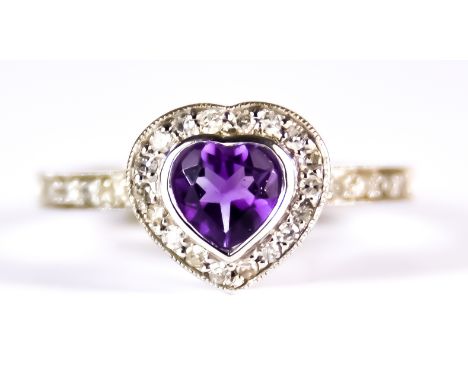 An Amethyst and Diamond Ring, Modern, 9ct white gold set with a centre heart shaped amethyst, approximately 1ct, surrounded a