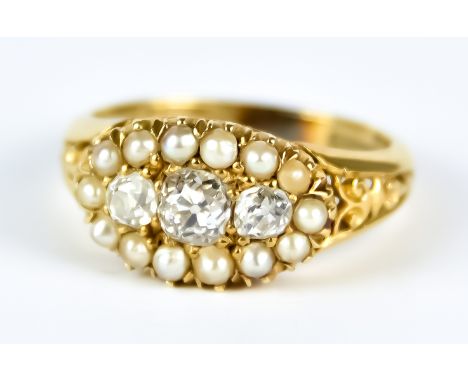 A Three Stone Diamond and Seed Pearl Ring, 20th Century, 18ct gold, set with three small brilliant cut white diamonds, approx