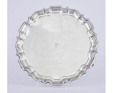 A George V Scottish Silver Circular Salver, by Hamilton &amp; Inches, Edinburgh, 1925, with shaped and moulded rim on three s