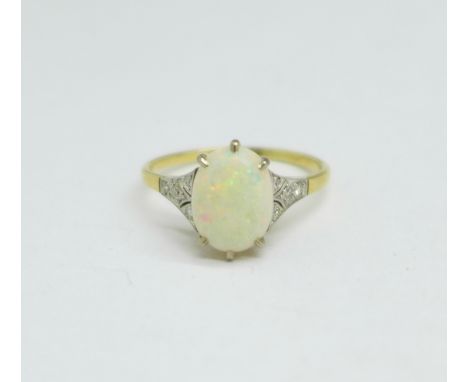 An Art Deco yellow metal and white metal set opal ring with diamond set shoulders, opal chipped, 2.7g, R,(tests as 18ct gold)