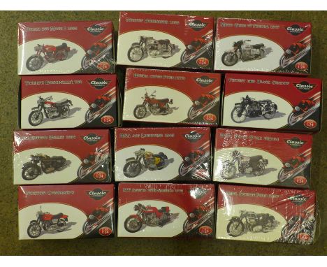 Twelve Atlas Editions 1/24 scale model motorbikes, boxed 