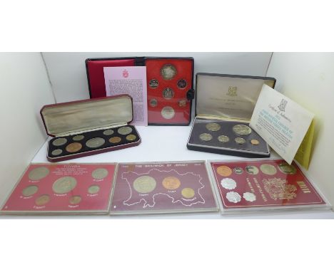 Coin sets including 1965 with Churchill crown, 1973 Royal Canadian Mint with silver dollar and 1973 First Official Coinage of