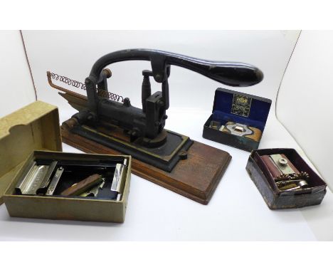 A c.1910 stapler and three razor sharpeners 