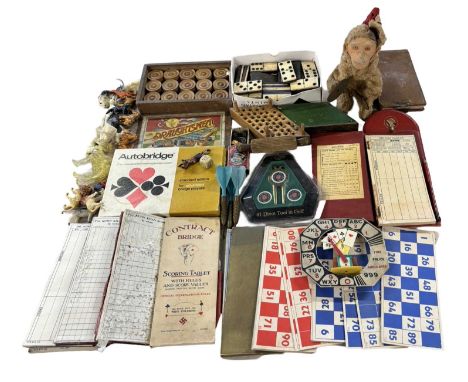 A collection of vintage toys and games, to include: wood and bone dominoes, cymbal-playing monkey, bridge scoresheets, draugh