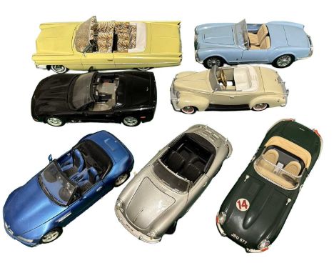 A collection of larger scale die cast model convertible cars, mostly Bburago