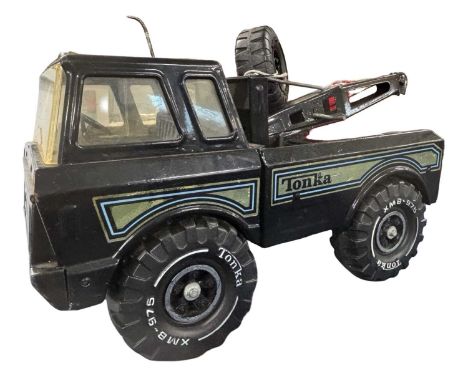 A pressed steel Tonka Tow Truck