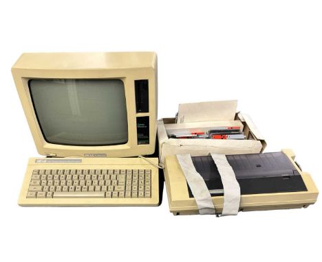An Amstrad PCW8256 computer system, including monitor, keyboard, printer and box of accessories
