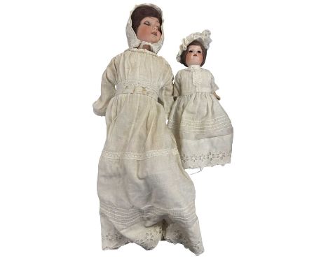 A pair of German bisque-head dolls, in need of restoration (2)