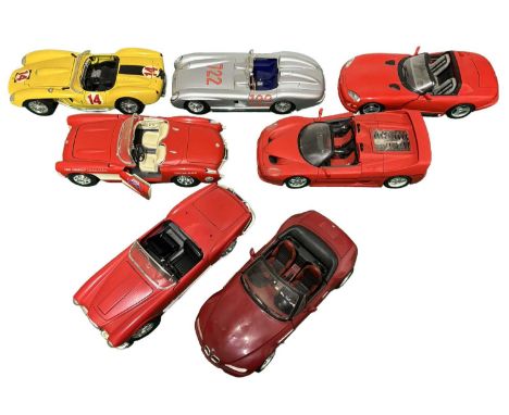 A collection of larger scale die cast model convertible race-cars, mostly Bburago
