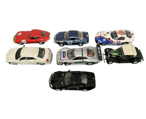 A collection of larger scale die cast model cars by Bburago