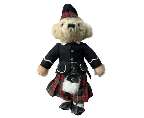 A Merrythought teddy bear in highland outfit.