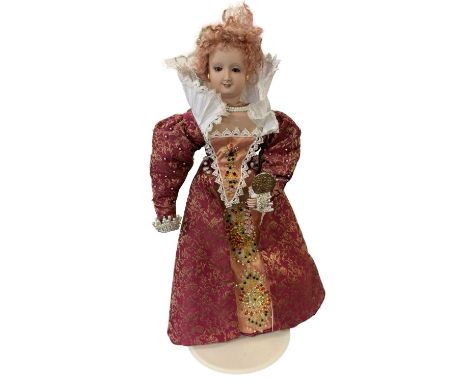 A porcelain collector's doll modelled after Queen Elizabeth I. Hight detailed within intricate beading to dress, ring, neckla