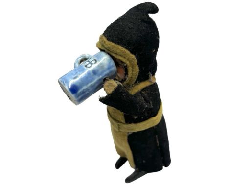 An early 1930s German-made Schuco mechanical dancing monk with beer stein. Lacking key