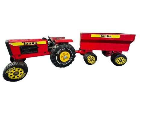 A pressed steel Tonka tractor and wagon