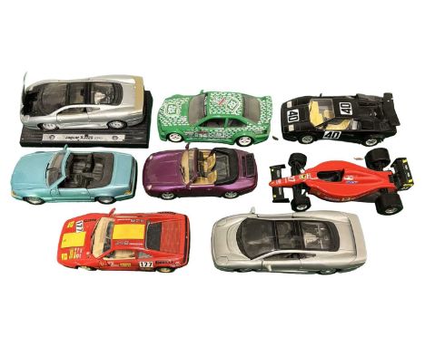 A group of mid-scale die-cast race cars by Bburago and Maisto