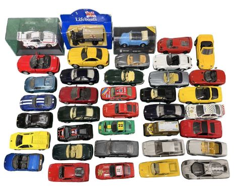 A group of small-scale die-cast racing cars, including Bburago, Maisto, MC Toys etc