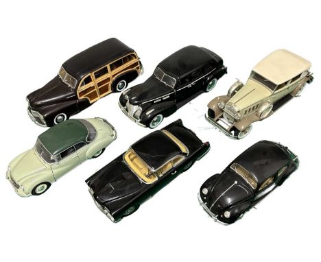 A collection of larger scale die cast model cars, mostly Bburago