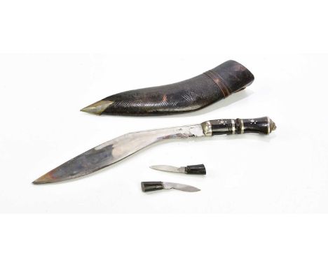 A 20th century Kukri knife and scabbard.