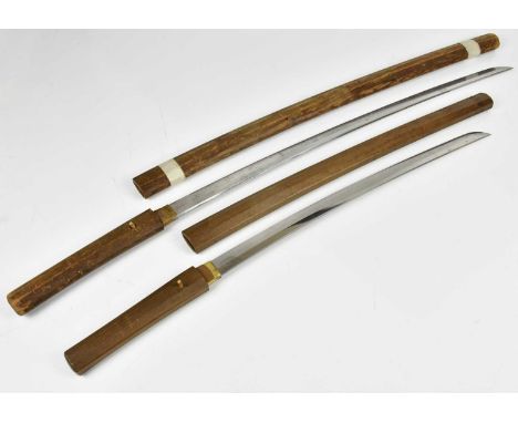 A Japanese Katana sword with wooden grip and scabbard, signed to handle, length of blade 72cm, together with a similar Wakiza