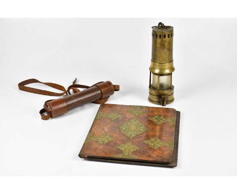 A three drawer brass telescope, together with a walnut and brass bound blotter and a brass miner's lamp inscribed 'Robert Wai