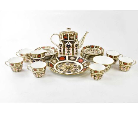 ROYAL CROWN DERBY; a twenty-two piece tea service in the 1128 pattern.Condition Report: Light wear but good condition, first 