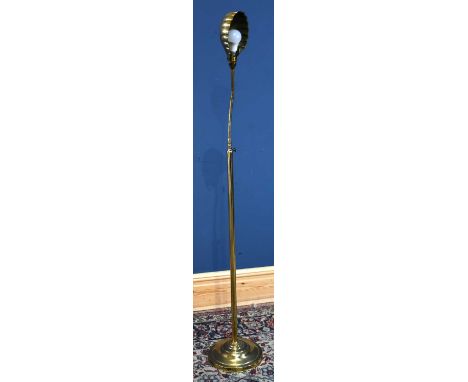A modern brass reading lamp, height 160cm.